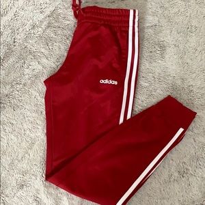 Red Adidas track pants